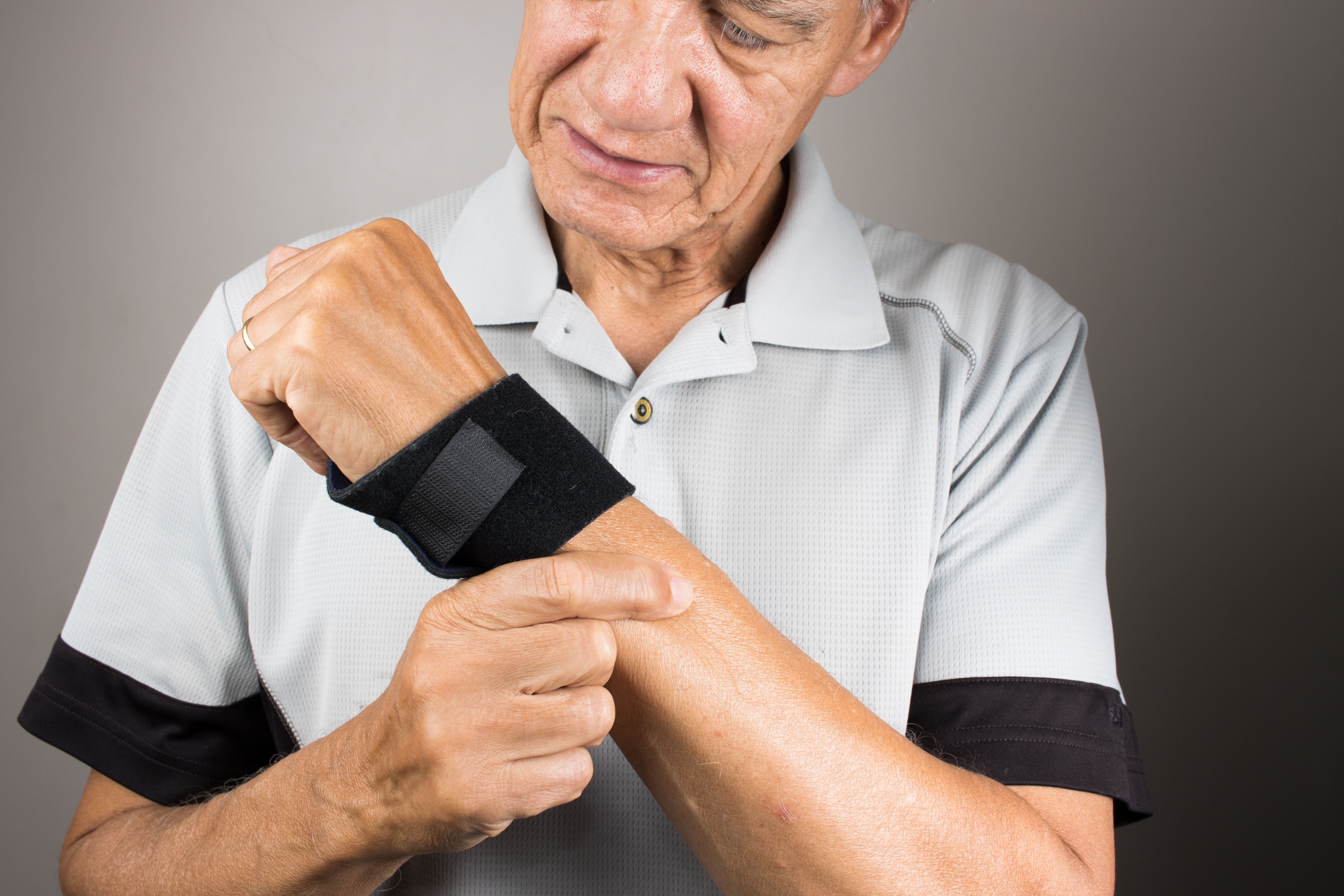 older man wearing wrist brace
