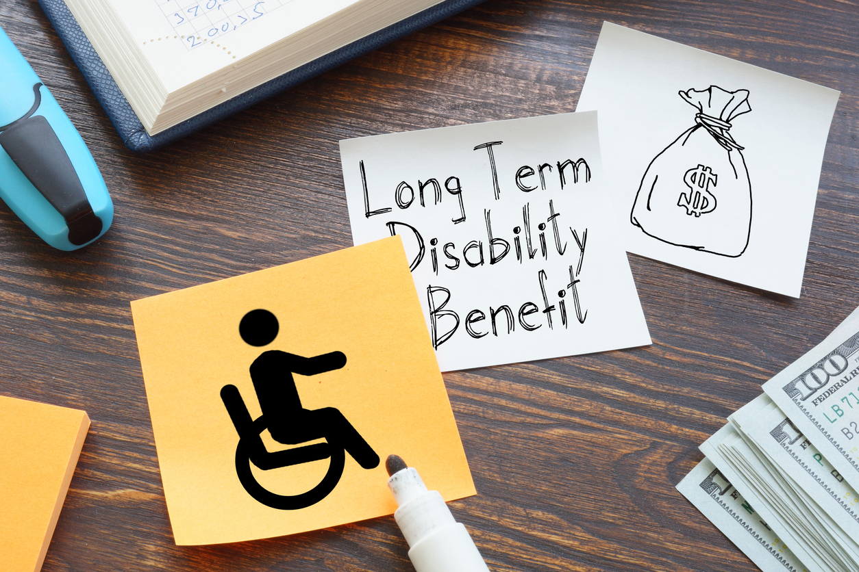 Post-It that reads Long-Term Disability and shows a wheelchair user stick person