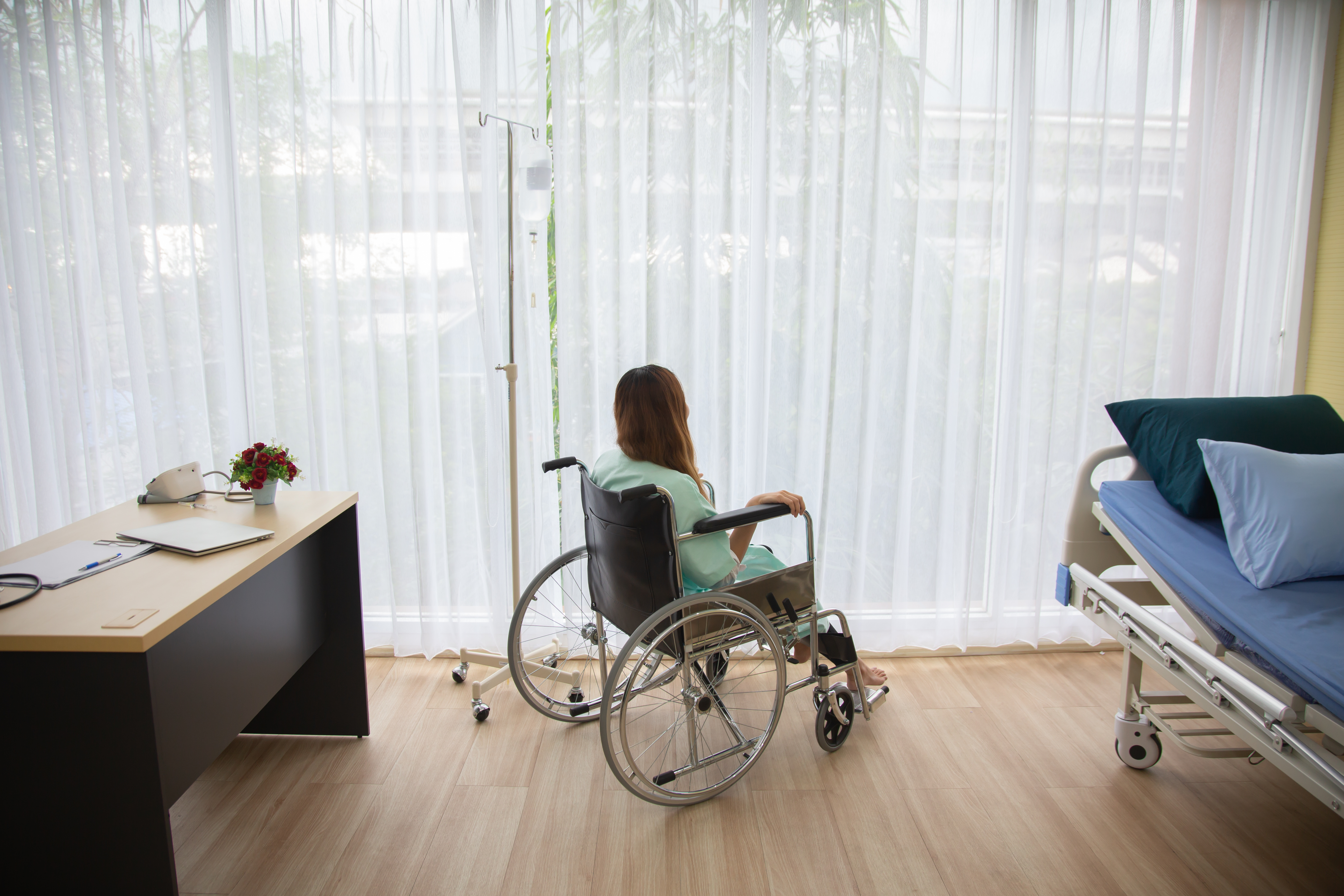 hospitalized women in a wheelchair
