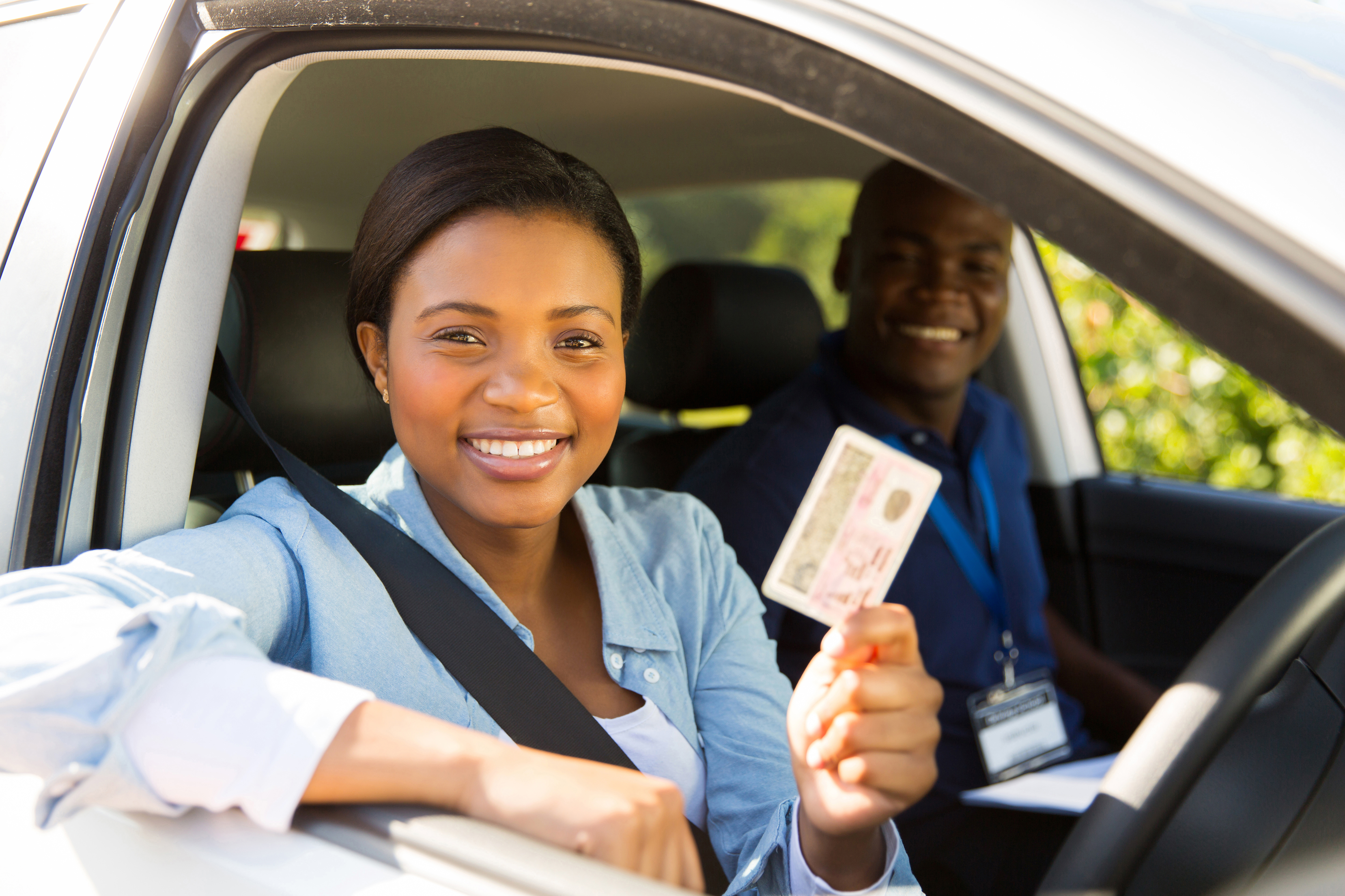 women holding a drivers license