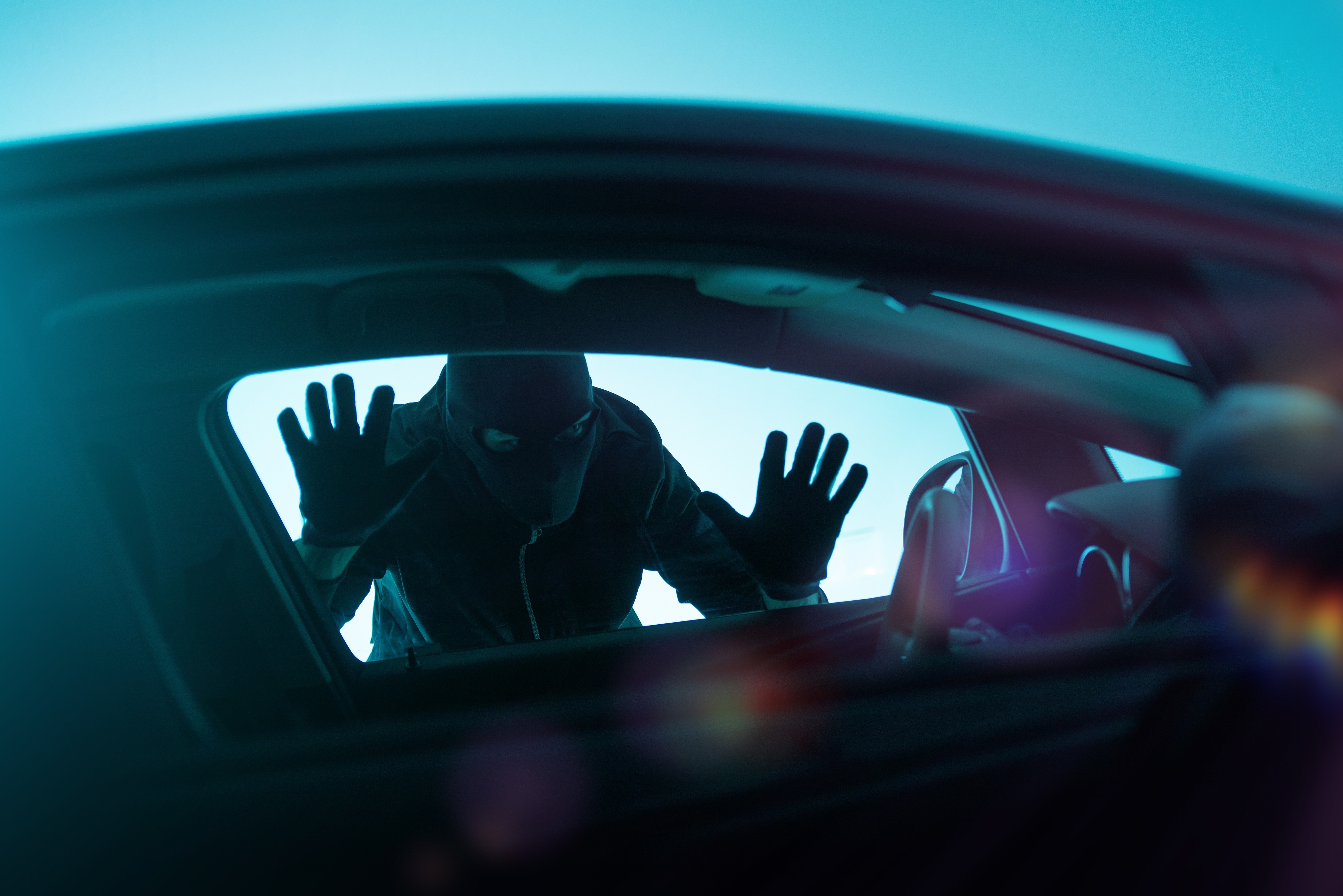 burglar at a car window